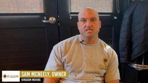 Sam McNeely, owner of Kingdom Moving, speaking about his moving business in a casual setting with branding visible.